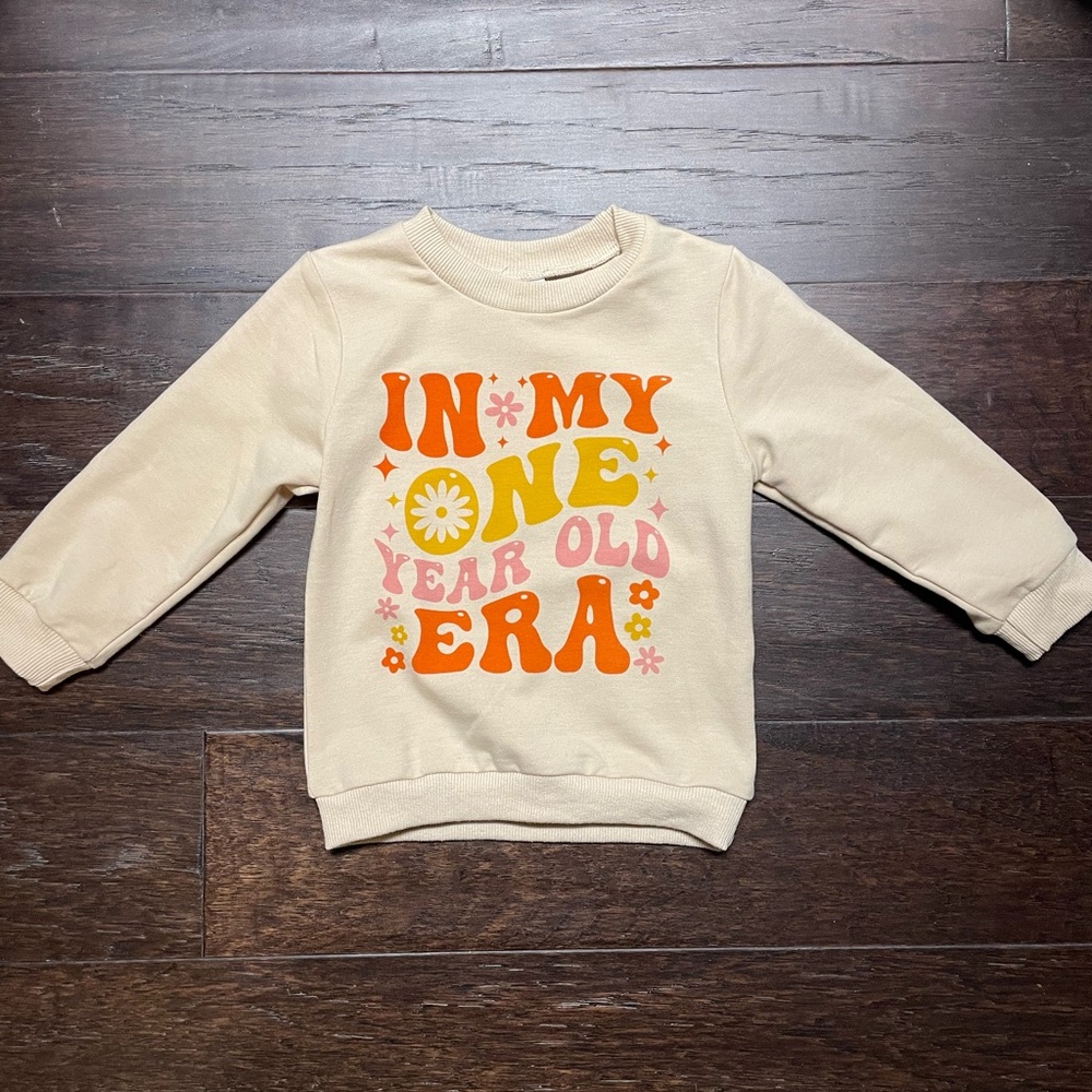 In my ONE Year Old Era long sleeve shirt size 12-18 month